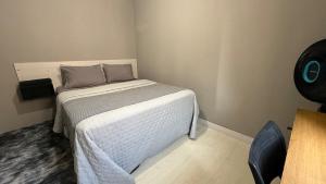 Postel nebo postele na pokoji v ubytování Seu lar perfeito fora de casa Prox ao Shopping Iguatemi