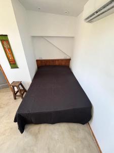 Postel nebo postele na pokoji v ubytování Monoambiente en la zona de La Rural con Wi Fi y pileta + 3 fotografie