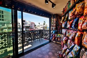 a store aisle with a view of a city at Cormorant Boutique Hotel in San Diego