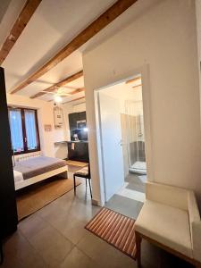 a living room with a bed and a couch at Charming Ringhiera Studio in Milan