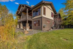 an image of a house with a yard at Ravenswood- Lake views- downtown greystone with air conditioning in McCall