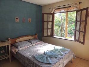 Postel nebo postele na pokoji v ubytování Canto Verde Pousada