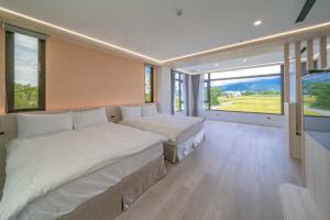 Postel nebo postele na pokoji v ubytování 融舍Villa 花蓮景觀包棟民宿