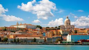 a view of a city from the water at InterContinental Lisbon by IHG in Lisbon