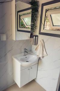 a bathroom with a sink and a mirror at Large and Spacious Double Bell Tents Great for Families in Carson, Washington in Carson