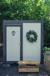 two white doors with a wreath on them at Large and Spacious Double Bell Tents Great for Families in Carson, Washington in Carson
