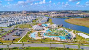 an aerial view of a resort with a water park at 3120-206DR STOREY LAKE, CONDO 2/2 GARDEN VIEW in Kissimmee