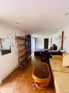 a living room with a couch and a table at Orchid bokor family guest house in Kampot
