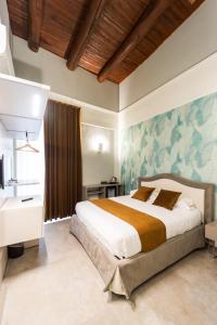 a bedroom with a large bed in a room at Dimora Botanica in Naples +242 photos