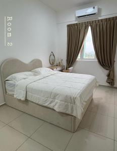 Ένα ή περισσότερα κρεβάτια σε δωμάτιο στο muji house d'aman residence alor setar