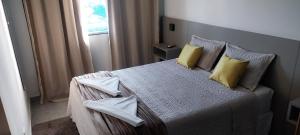 Ένα ή περισσότερα κρεβάτια σε δωμάτιο στο Flat's Da Bia +57 φωτογραφίες