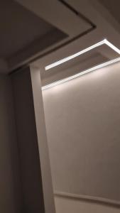 a light on the ceiling of a room at Breathtaking Nest 2, cosy and spacious in Kampala