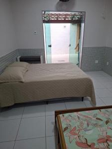 En eller flere senge i et værelse på Vila Forte do Mar