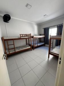 En eller flere senge i et værelse på Vila Forte do Mar