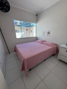 En eller flere senge i et værelse på Vila Forte do Mar