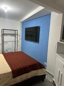 Ένα ή περισσότερα κρεβάτια σε δωμάτιο στο Momentos de Paz