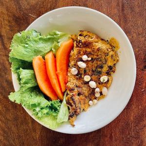 a white bowl of food with lettuce and carrots at Bubble Paradise, Koh ta Kiev in Koh Ta kiev Island +37 photos