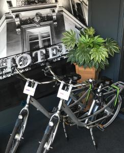 a bicycle parked in front of a window at Citiez Hotel Amsterdam in Amsterdam
