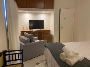 Et tv og/eller underholdning på Recevoir Garden Suítes