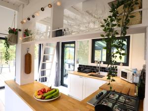 a kitchen with a bowl of fruit on a counter at Agathe in Laforêt
