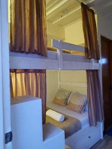 a couple of bunk beds in a room at Bolo Airport Dormitel in Mactan Cebu International