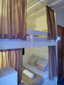 a couple of bunk beds in a room at Bolo Airport Dormitel in Mactan Cebu International