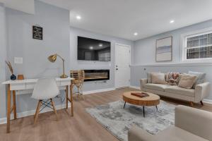 a living room with a couch and a table at The Boho Lux Haven Prov in Providence