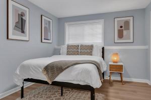 a bedroom with a large bed and a window at The Boho Lux Haven Prov in Providence