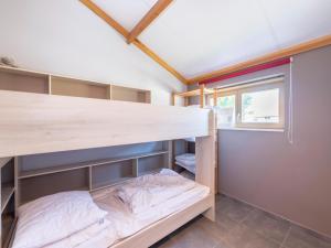 a bunk bed in a room with a window at Westhinder I H21 in Koksijde