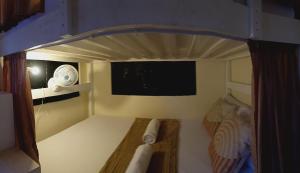 an overhead view of a bunk bed in a boat at Bolo Airport Dormitel in Mactan Cebu International +3 photos