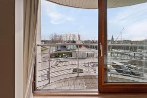 a balcony with a view of a marina at Harbour View 2A in Zeebrugge +3 photos