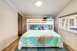 a bedroom with a white bed and a window at Sip and Hike! Autumn Escape 12 Mi to Traverse City in Grawn