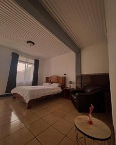 Ένα ή περισσότερα κρεβάτια σε δωμάτιο στο Hotel & Restaurante Tabacones