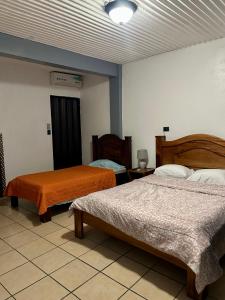 Ένα ή περισσότερα κρεβάτια σε δωμάτιο στο Hotel & Restaurante Tabacones