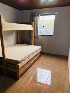 Postel nebo postele na pokoji v ubytování Casa em Pontal do Parana com Piscina