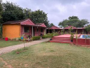 a row of houses with a yard at Blue Tree Resort in Pushkar