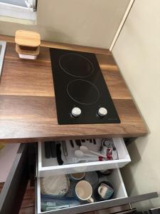 a stove top oven sitting on top of a drawer at Colombiano boricua in Quebradillas +6 photos