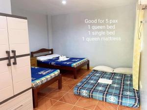 Postel nebo postele na pokoji v ubytování Onde's Guest House