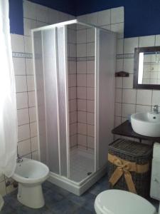 a bathroom with a shower and a toilet and a sink at Sognare sul mare in Granelli