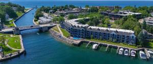 an aerial view of a resort on a river at 103 Edgewater Inn in Charlevoix