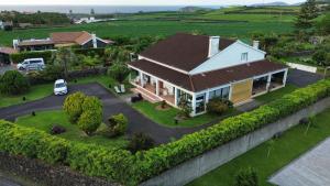 an aerial view of a house with a yard at Sermar in Rabo de Peixe