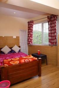 Ένα ή περισσότερα κρεβάτια σε δωμάτιο στο valparai villas