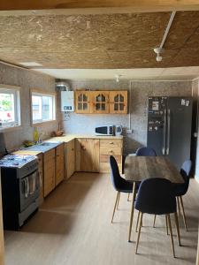 Kuchyň nebo kuchyňský kout v ubytování Cabañas el mañio