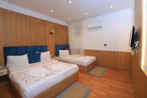 Ένα ή περισσότερα κρεβάτια σε δωμάτιο στο Sóul In Pyramids View +69 φωτογραφίες