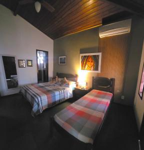 Postel nebo postele na pokoji v ubytování Encantos do mar