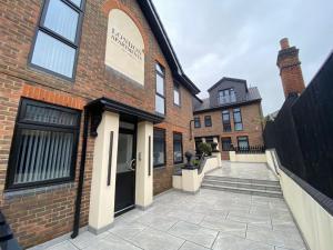a brick building with a door on the side of it at The Rye Retreat - 1BR Modern Design with Smart TV & Secure Underground Parking in Central High Wycombe HP13, Sleeps 3 in High Wycombe