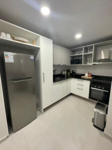 Una cocina o cocineta en Modern apartment in Las Mercedes - Asunción 19 fotos más