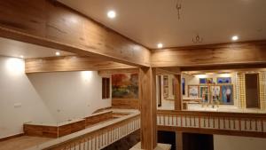 a large room with wooden walls and ceilings at RKVilla in Tirupati