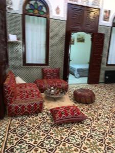 Una cama o camas en una habitación de Dar Nassiri