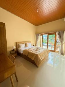 Postel nebo postele na pokoji v ubytování Bagus ayu Lovina homestay